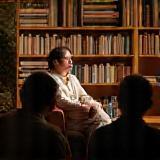 Author giving a reading to an engaged audience