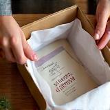 A wrapped book package being unboxed